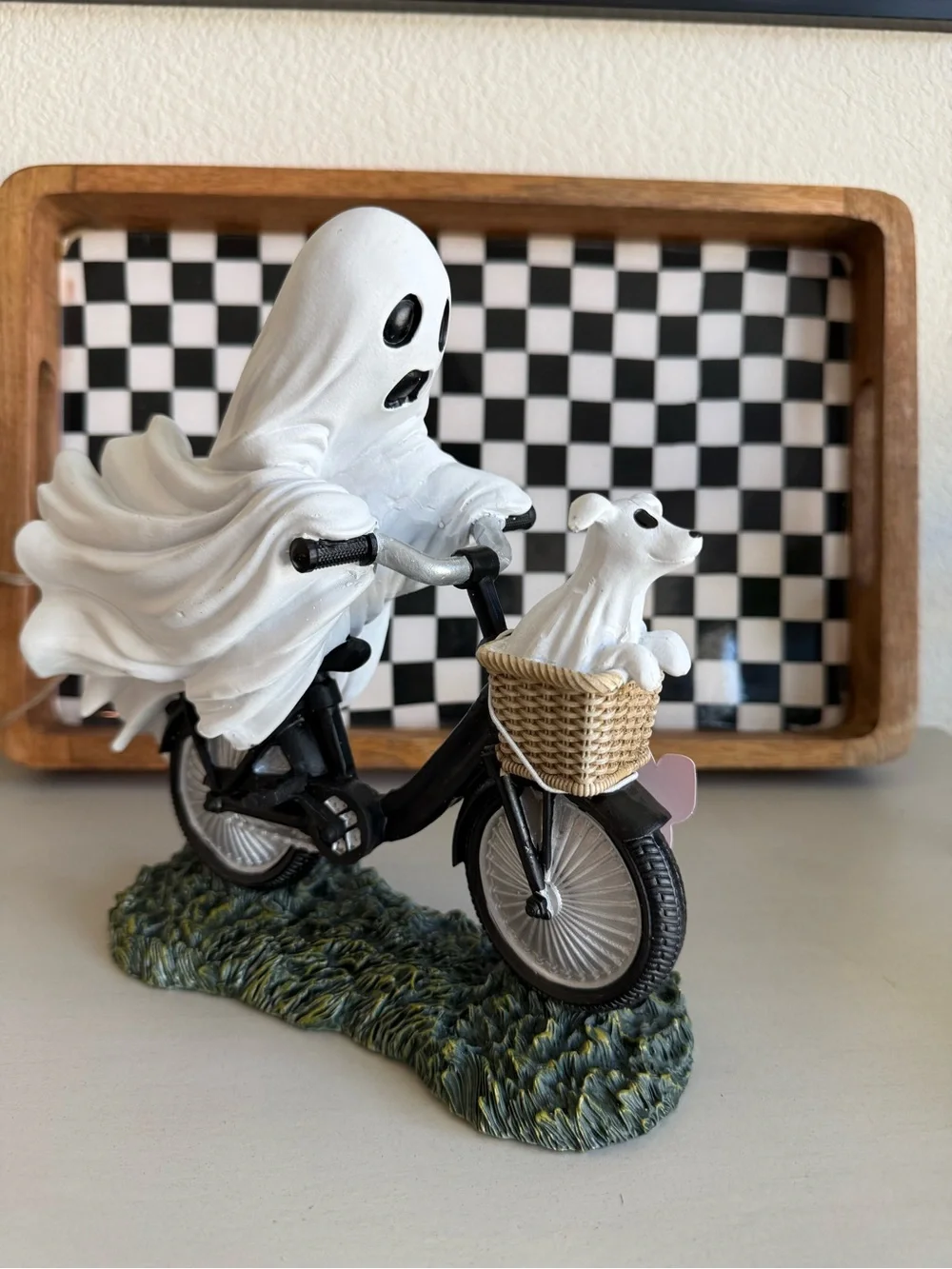 White Ghost Figurine Riding Bicycle with Dog in Basket